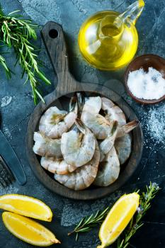 shrimps on wooden board and on a table