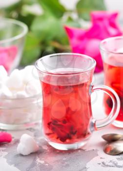 tea with rose on a table, stock photo