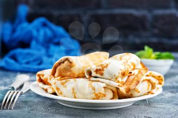 pancakes on plate and on a table