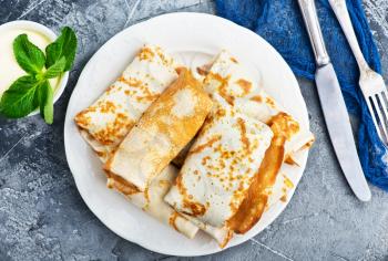 pancakes on plate and on a table