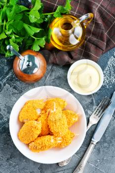 crab claws in bowl and on a table