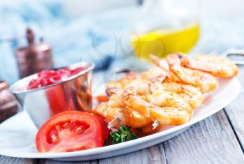 fried shrims with tomato sauce and lemon