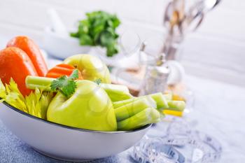 ingredients for diet salad, apples and celery and fresh carrots