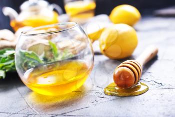 honey,fresh mint and lemons on a table