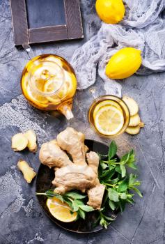 fresh ginger,herb and tea on a table