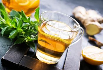 fresh ginger,herb and tea on a table