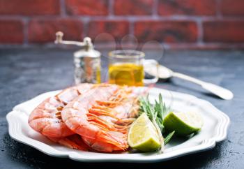 boiled shrimps on plate, shrimps with salt and lemon