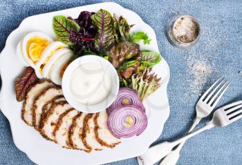 baked meat with salad and sauce, diet food