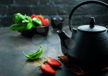 Tea with fresh basil and strawberry, fresh herbal tea