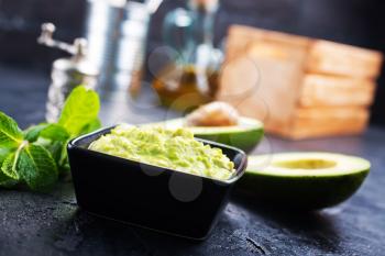 avocado sauce with lime in bowl, sauce in bowl