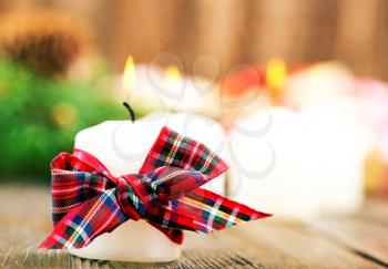 candles with ribbon on a table, christmas decoration