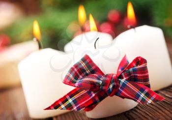 candles with ribbon on a table, christmas decoration