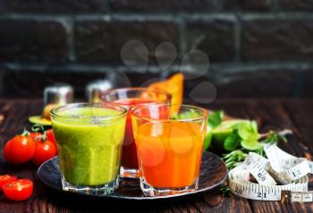 smoothies in glass and on a table
