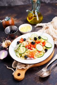 salad with pasta and vegetables on plate