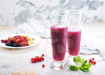 smoothie from berries in glasses and on a table
