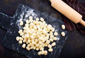 raw potato gnocchi on a table,stock photo