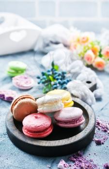 macaroons on wooden board and on a table