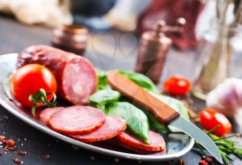 smoked sausage with spice and fresh basil