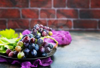 grape on plate and on a table