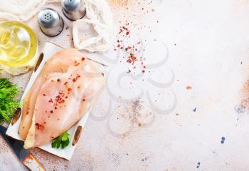 raw chicken fillet with salt, stock photo