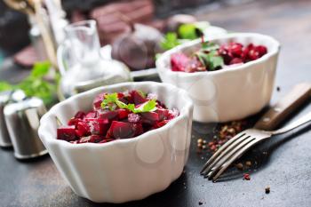 salad with boiled beet in the bowls