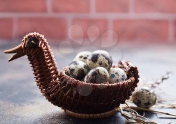 quail eggs in basket and on a table, stock photo