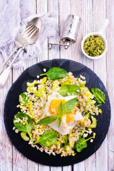 fried bulgur with basil and fried chicken egg