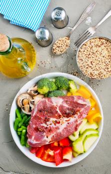 raw meat with vegetables on plate, ingredients for dinner