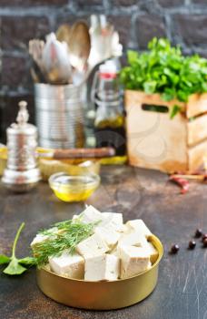 tofu cheese in metal bowl on a table