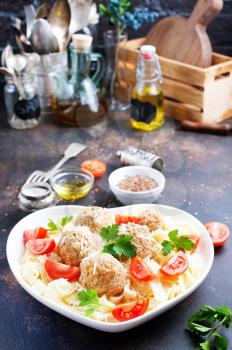 pasta with meatballs and fresh tomato in bowl