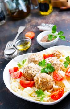 pasta with meatballs and fresh tomato in bowl