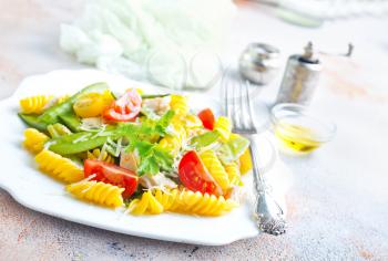 pasta with grilled chicken meat, vegetables and cheese