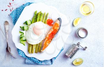 breakfast, fried fish with asparagus and egg
