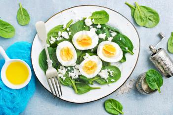 salad with boiled eggs on plate, stock photo