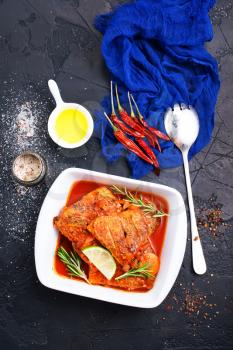 fish with tomato sauce and aroma spices, stock photo