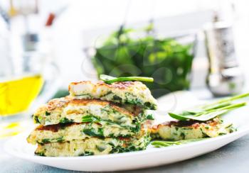 omelette with spinach leaves, diet food, omelette on plate