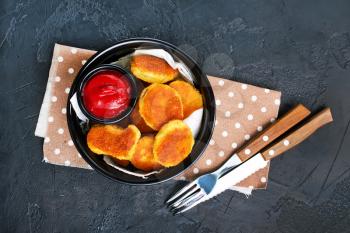 nuggets with tomato sauce on plate , stock photo