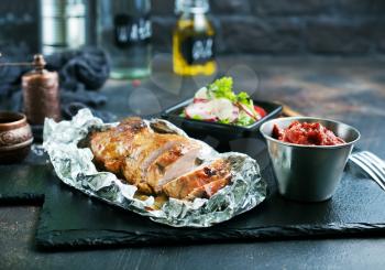 baked meat with spice, meat in foil,stock photo