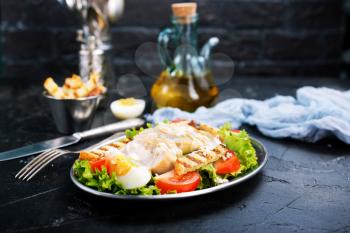 salad with baked chicken fillet, salad on plate
