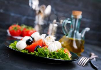 Vegetable salad on plate, greek salad, fresh salad with feta cheese