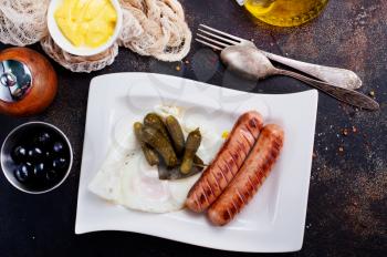 fried sausages, sausages on white plate, stock photo
