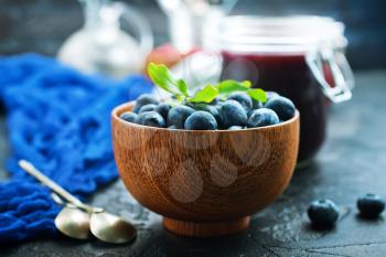 fresh blueberry in bowl and on a table