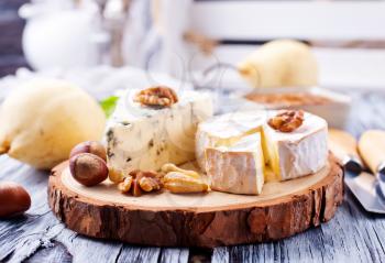 camambert cheese with dry almond on a table