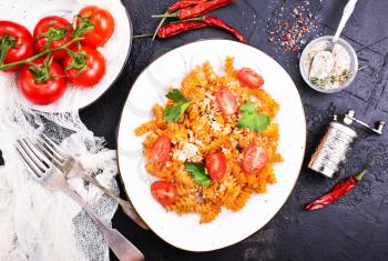 boiled pasta with tomato sauce and grated cheese