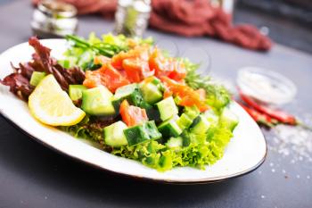 fresh salad with salmon, salad on plate