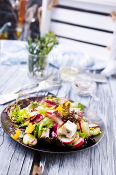 greek salad on plate on a table