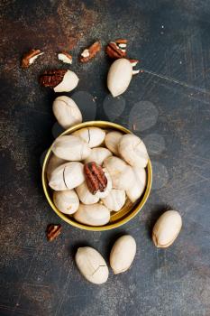 Pecan nuts in metal bowl, pecan nuts in shell