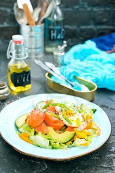 fresh salad with raw salmon avocado vegetables