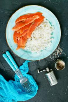 boiled rice with salmon on plate, diet food