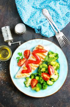 fried chicken with boiled broccoli and tomato sauce